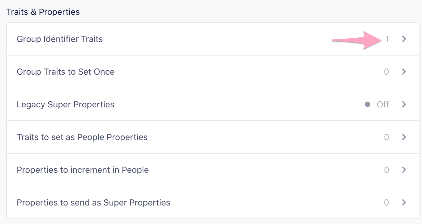 The Mixpanel Traits and Properties list showing the 'Group Identifier Traits' field where one or more traits (like company_id) can be defined for grouping users.
